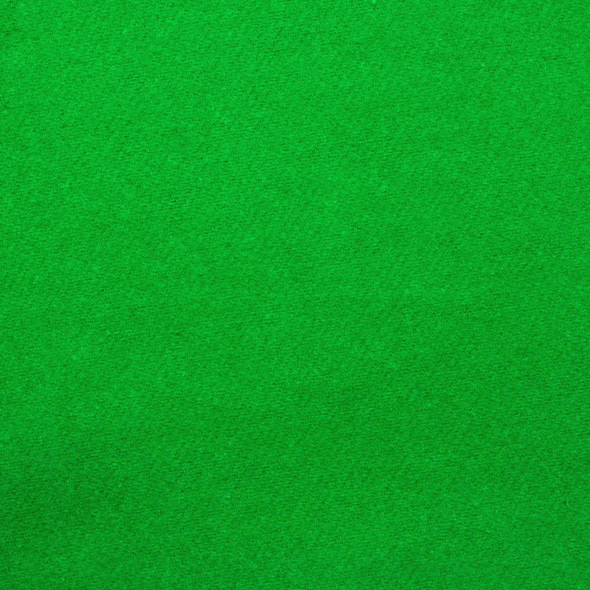Theaterdoek in chromakey groen – vlakke close-up van de stofstructuur